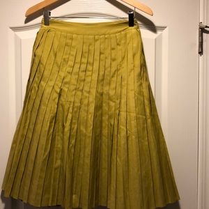 Green pleated skirt